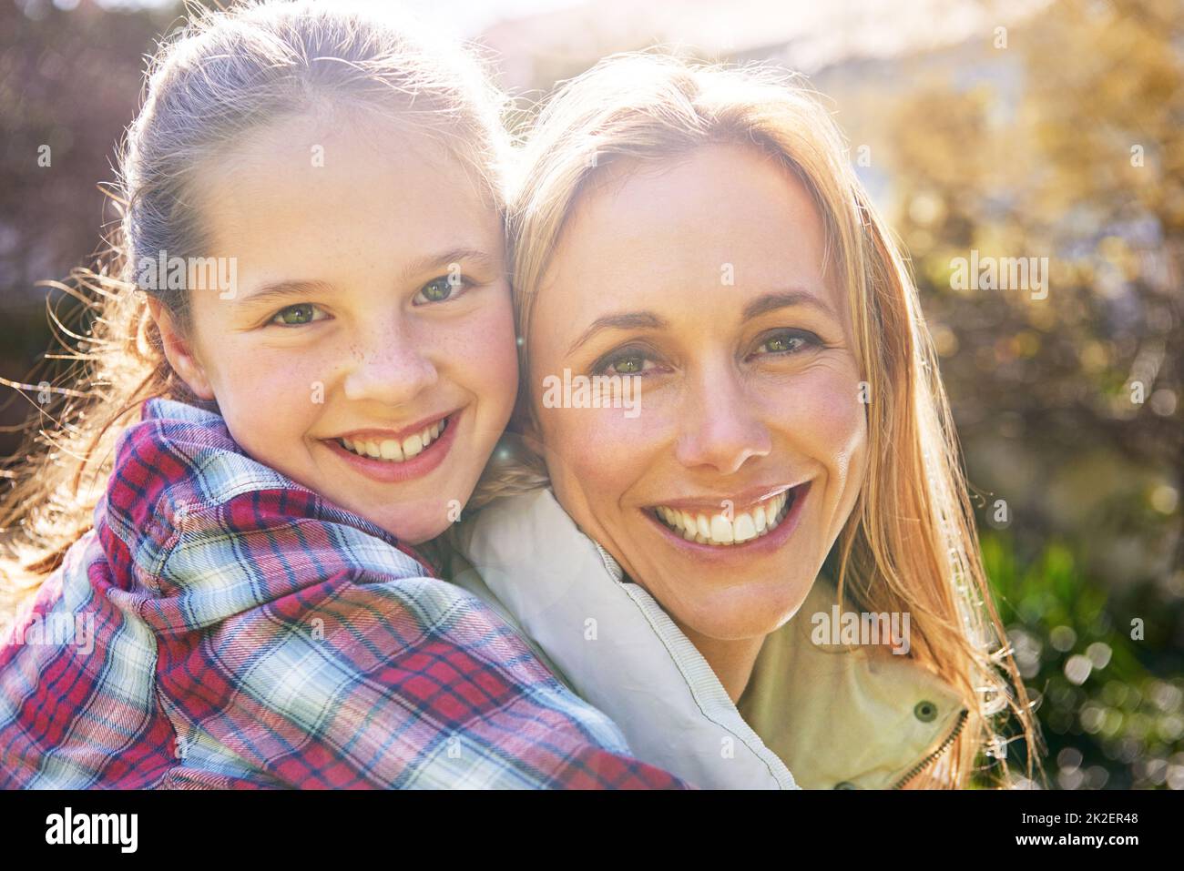 First my mother, forever my friend. A happy mother and daughter spending time together outdoors. Stock Photo