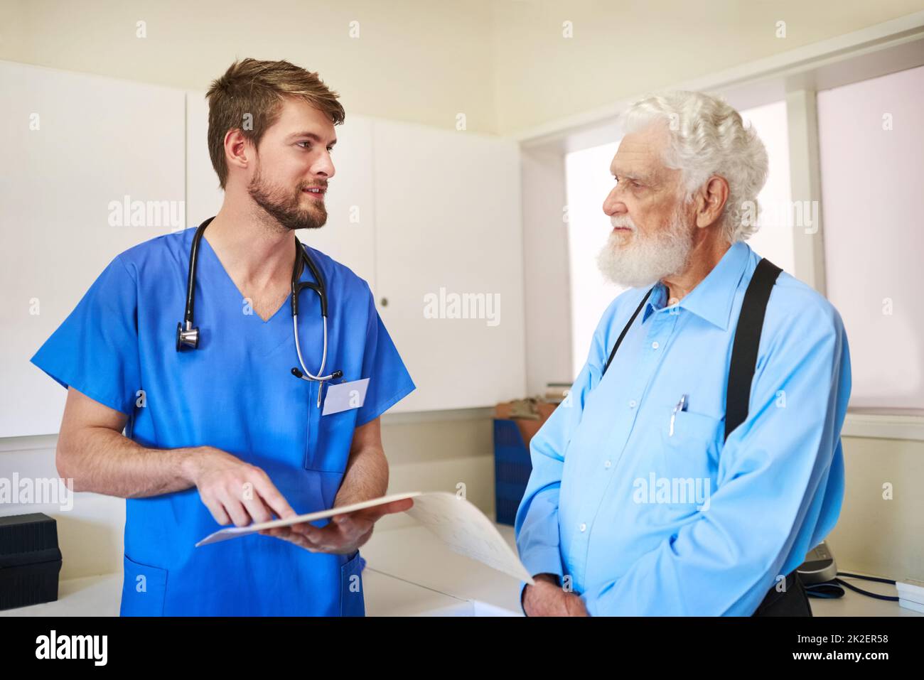 Well get to the bottom of your pain. Shot of a young doctor and his