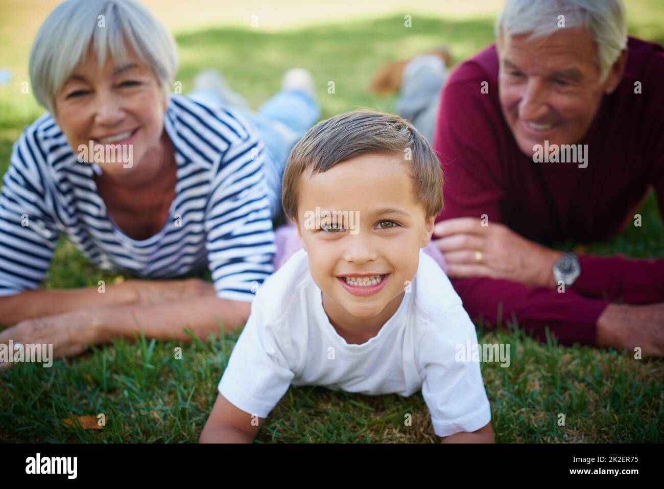 They love him to bits. Cropped portrait of a little boy spending time with his grandparents. Stock Photo
