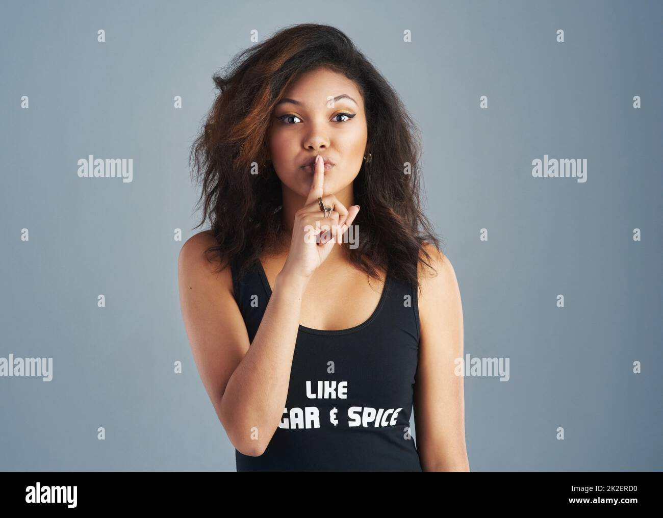 My lips are sealed. Portrait of an attractive young woman posing