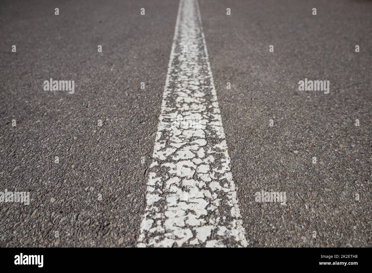 Asphalt road with single solid white line road marking Stock Photo