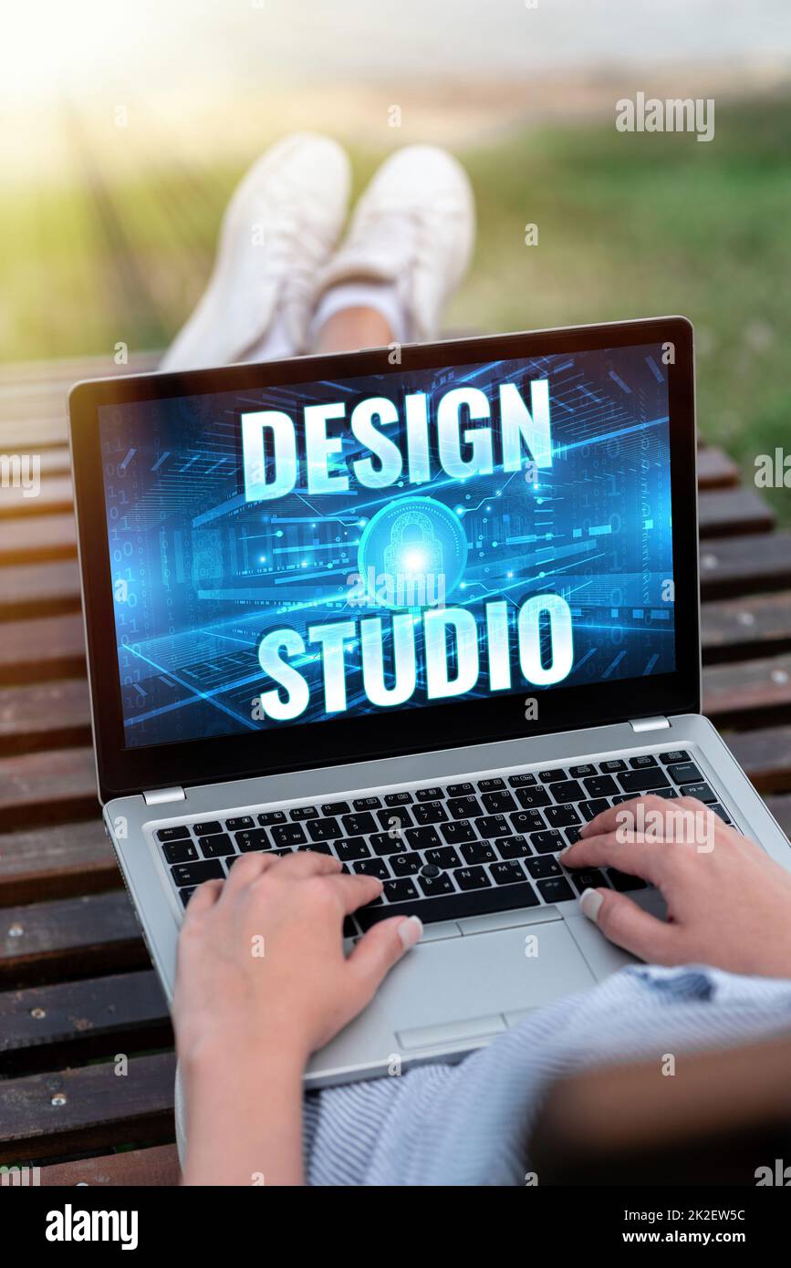Text showing inspiration Design Studio. Business idea work environment specifically for designers and artisans Laptop Resting On Lap Of Woman With Cross Leg Accomplishing Remote Job. Stock Photo
