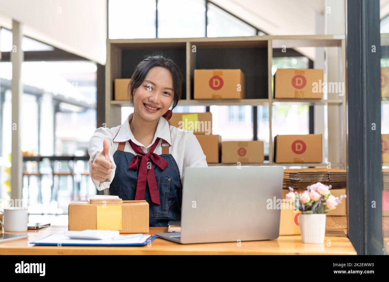 Happy successful SME entrepreneur with thumps up, Home office, Business online and delivery, Selling online, Startup small business concept. Stock Photo