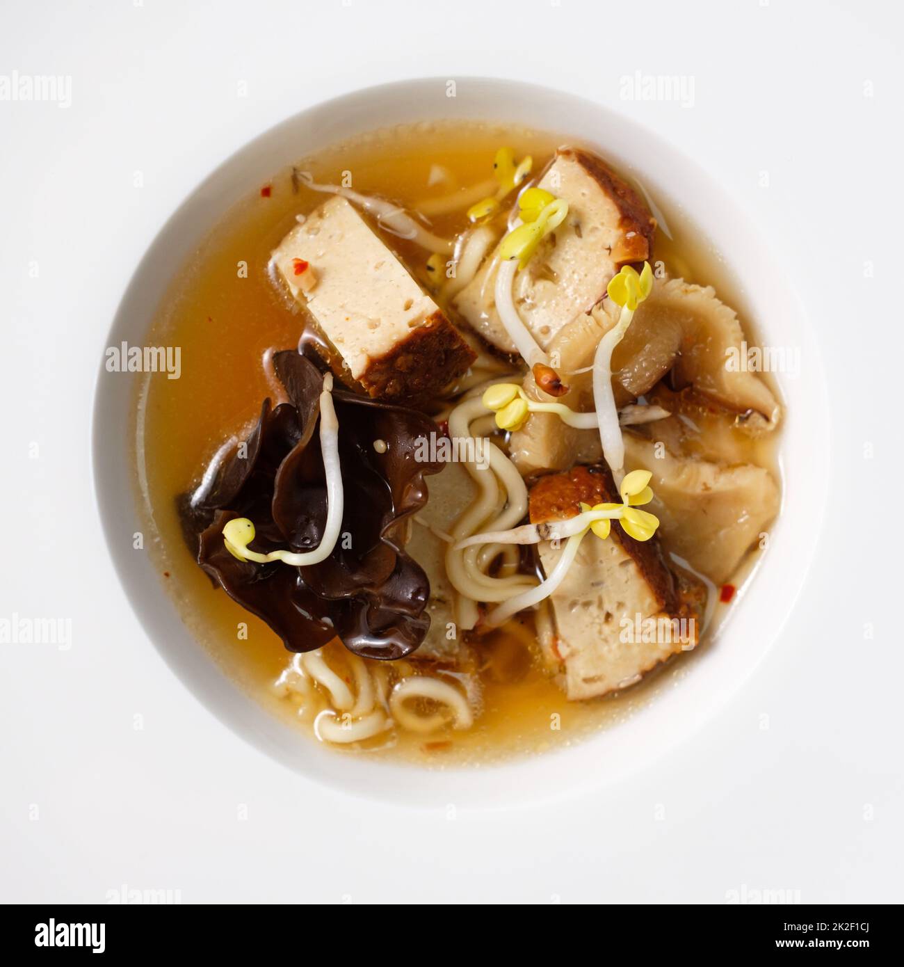 Ramen soup with tofu sprouts and mushrooms from above Stock Photo