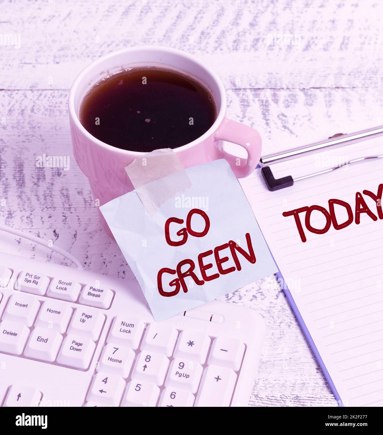 Hand writing sign Go Green. Concept meaning making more environmentally friendly decisions as reduce recycle New Coffee Shop Ideas Writing Important Notes Coffee Break Time. Stock Photo