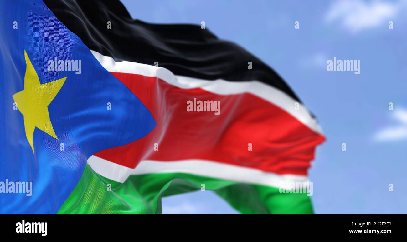 Detail of the national flag of South Sudan waving in the wind on a clear day Stock Photo