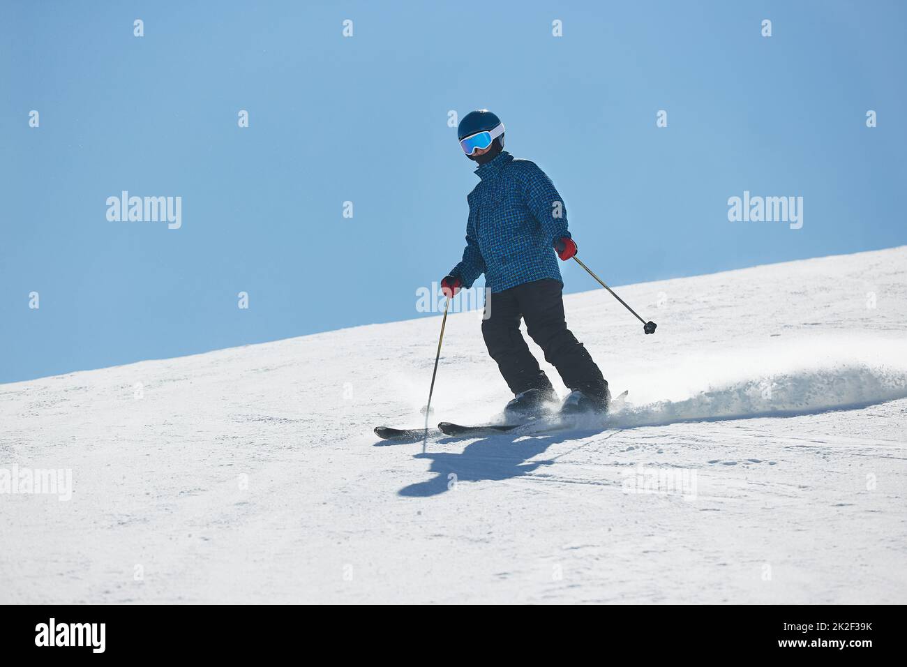 Skiing in the winter snowy slopes Stock Photo Alamy