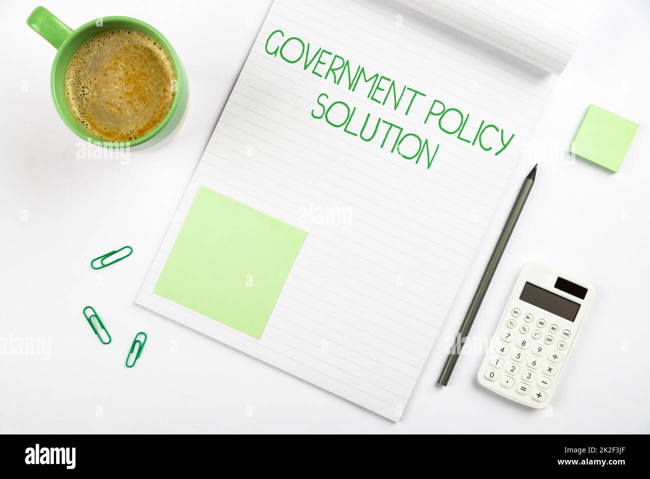 Conceptual caption Government Policy Solution. Word for designed game plan created in response to emergency disaster Multiple Assorted Collection Office Stationery Photo Placed Over Table Stock Photo