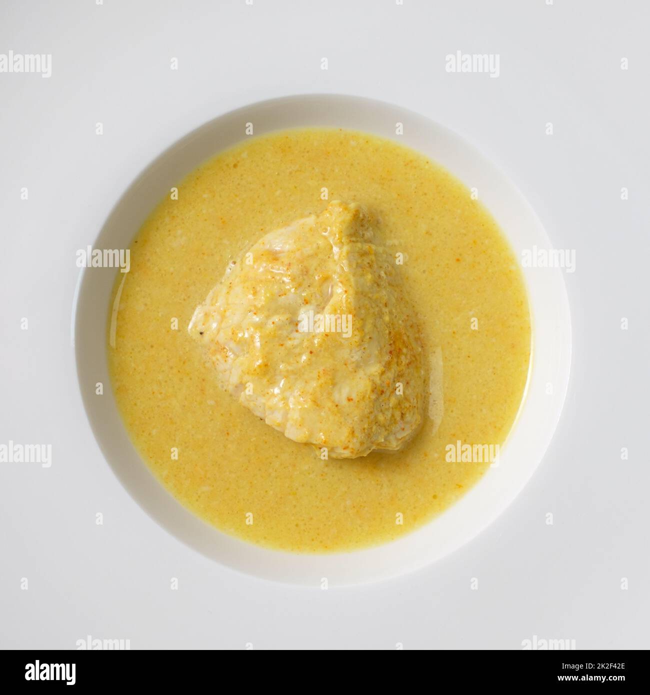 Curry chicken with coconut milk in a plate Stock Photo