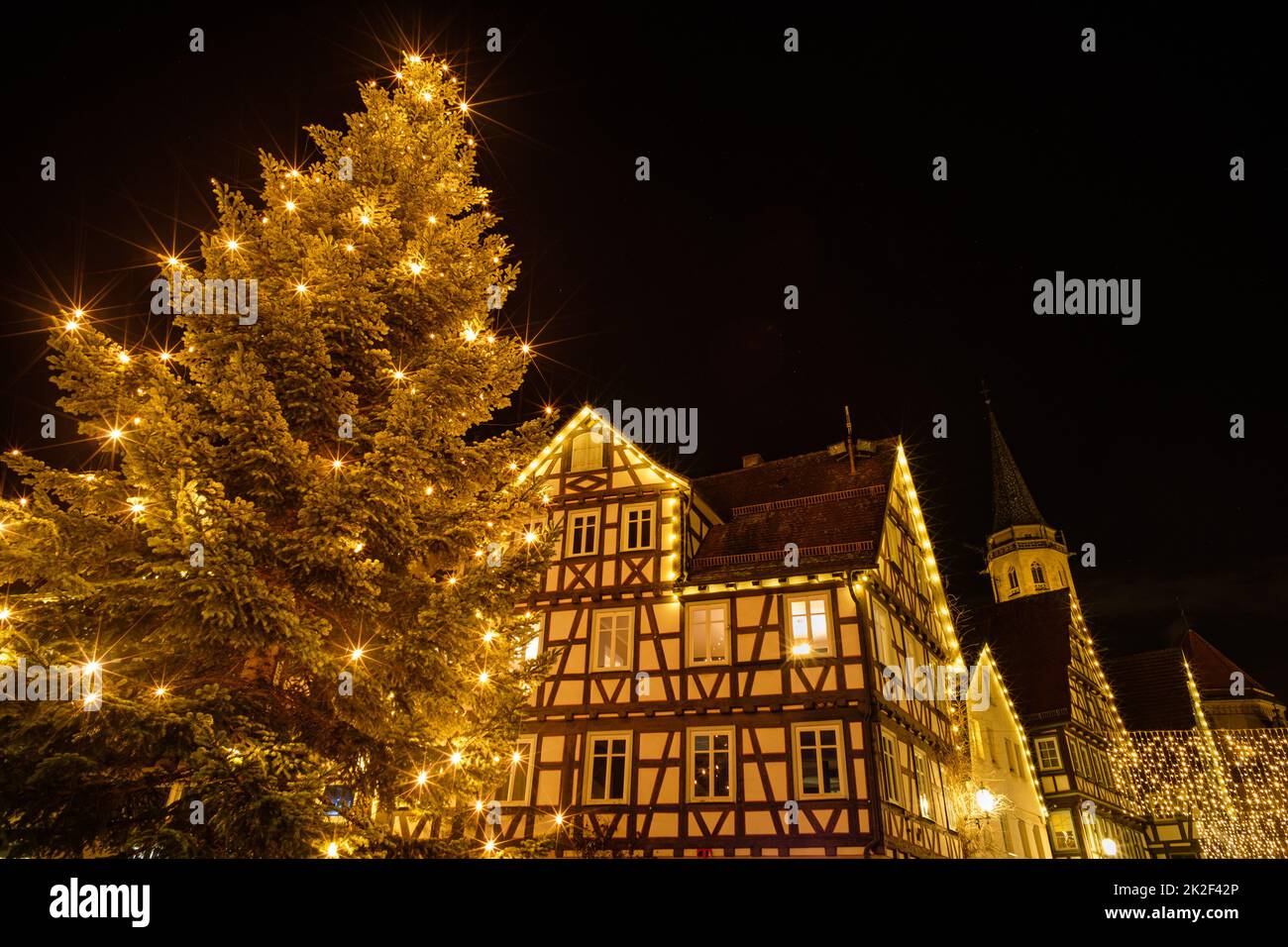 Christmas tree with half-timbered house and church in Germany Stock Photo