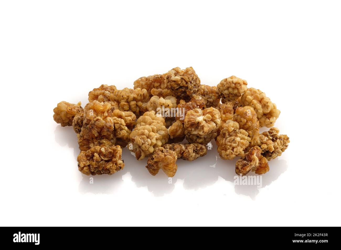 Close-up dried red mulberry fruits on white isolated Stock Photo