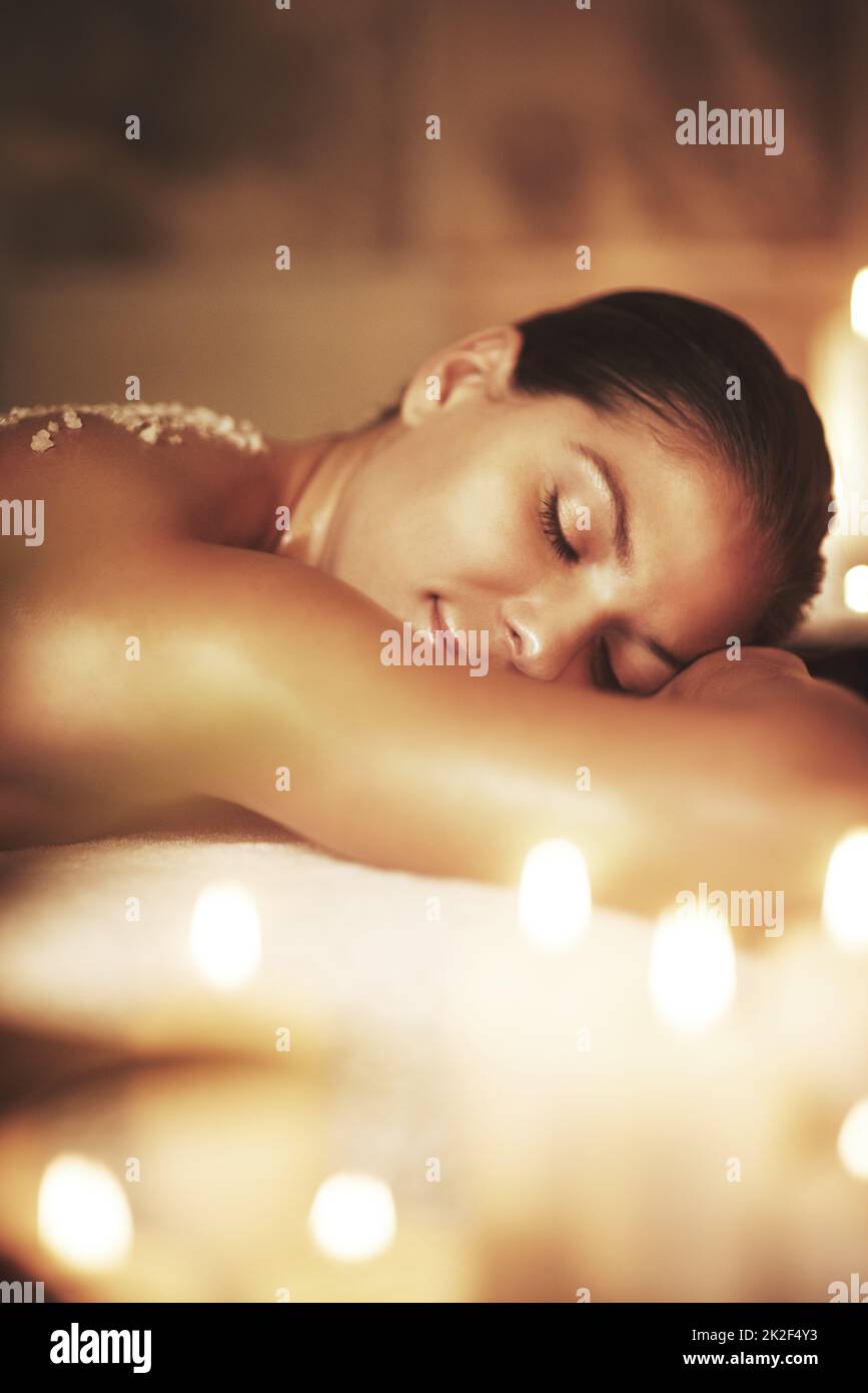 Allow yourself to be where you are. Cropped shot of a young woman getting an exfoliating treatment at the spa. Stock Photo