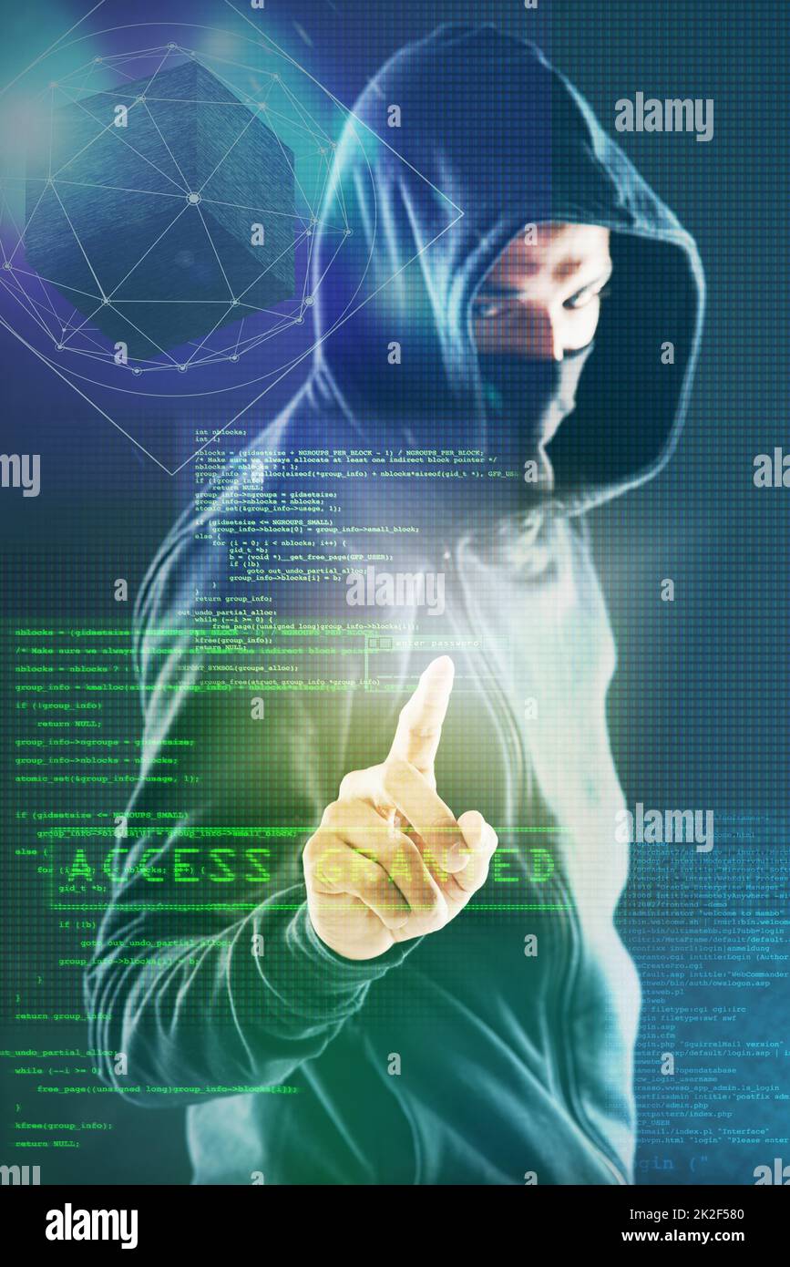 How secure are you really. Portrait of a menacing computer hacker posing against a dark background in studio. Stock Photo