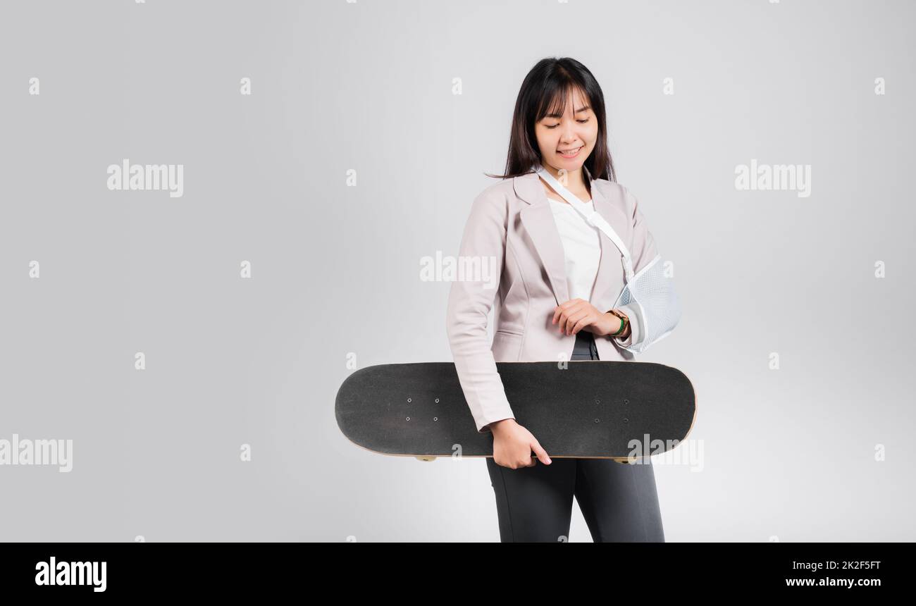 Woman smile broken arm after accident wear arm splint for treatment she