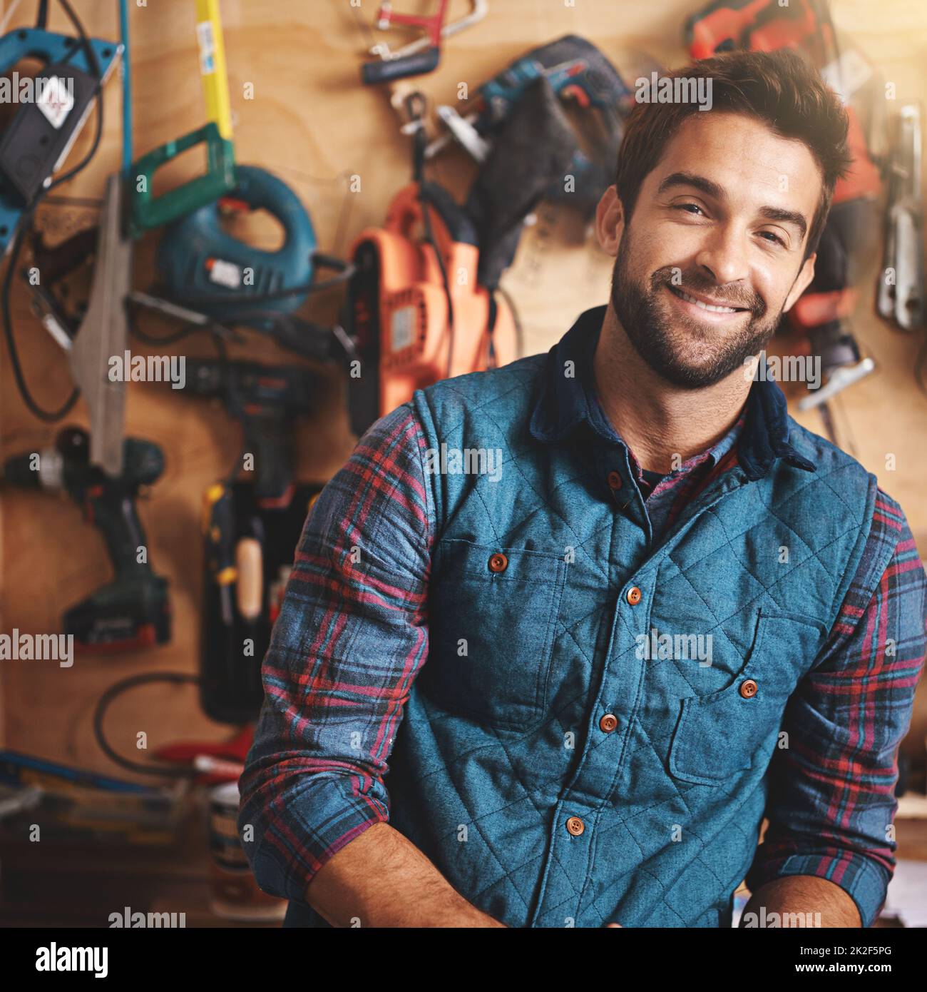 Ive got the tools to get the job done. Portrait of a man standing in his workshop. Stock Photo