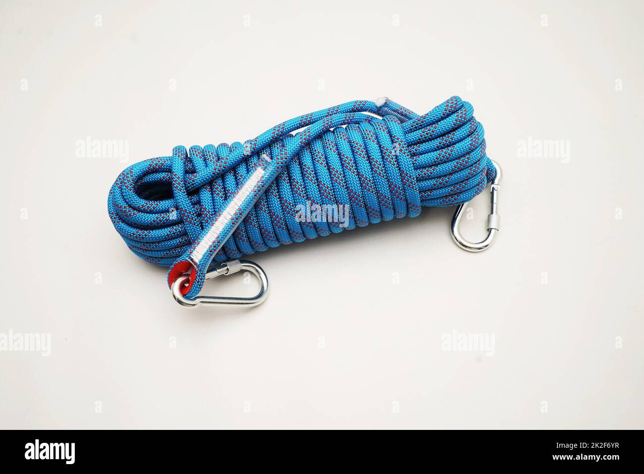 Blue climbing rope on white background Stock Photo
