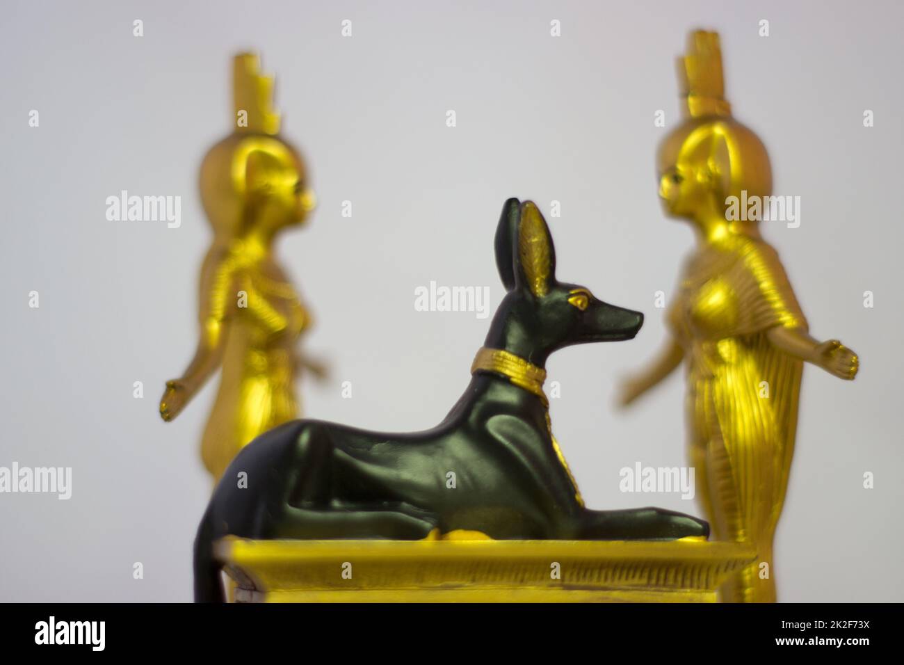Egyptian statues anubis eset nebtht in gold Stock Photo