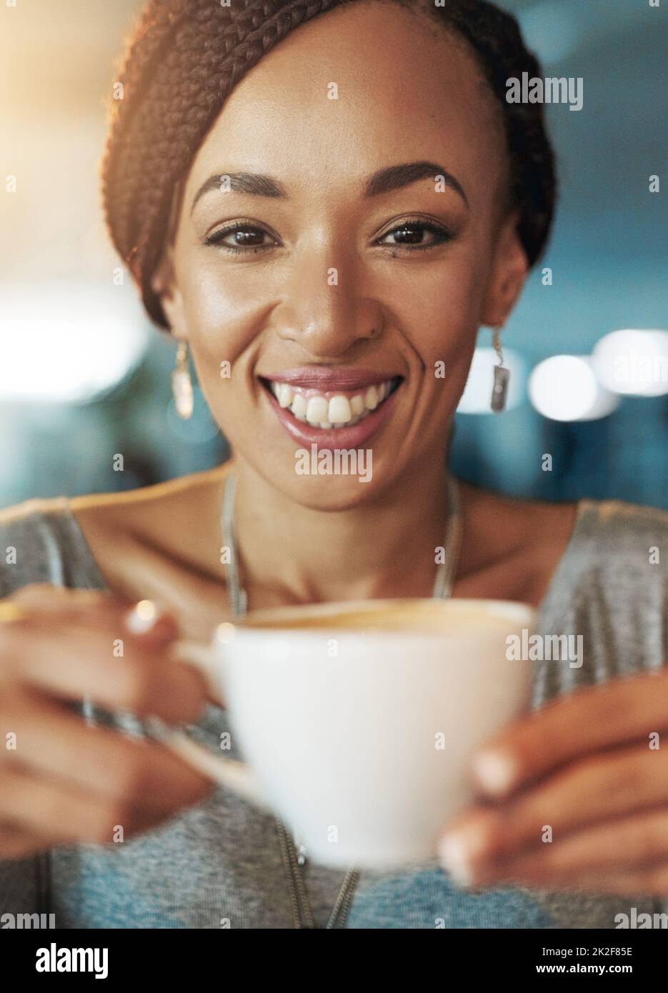 Coffee keeps me going. Cropped portrait of a young woman drinking
