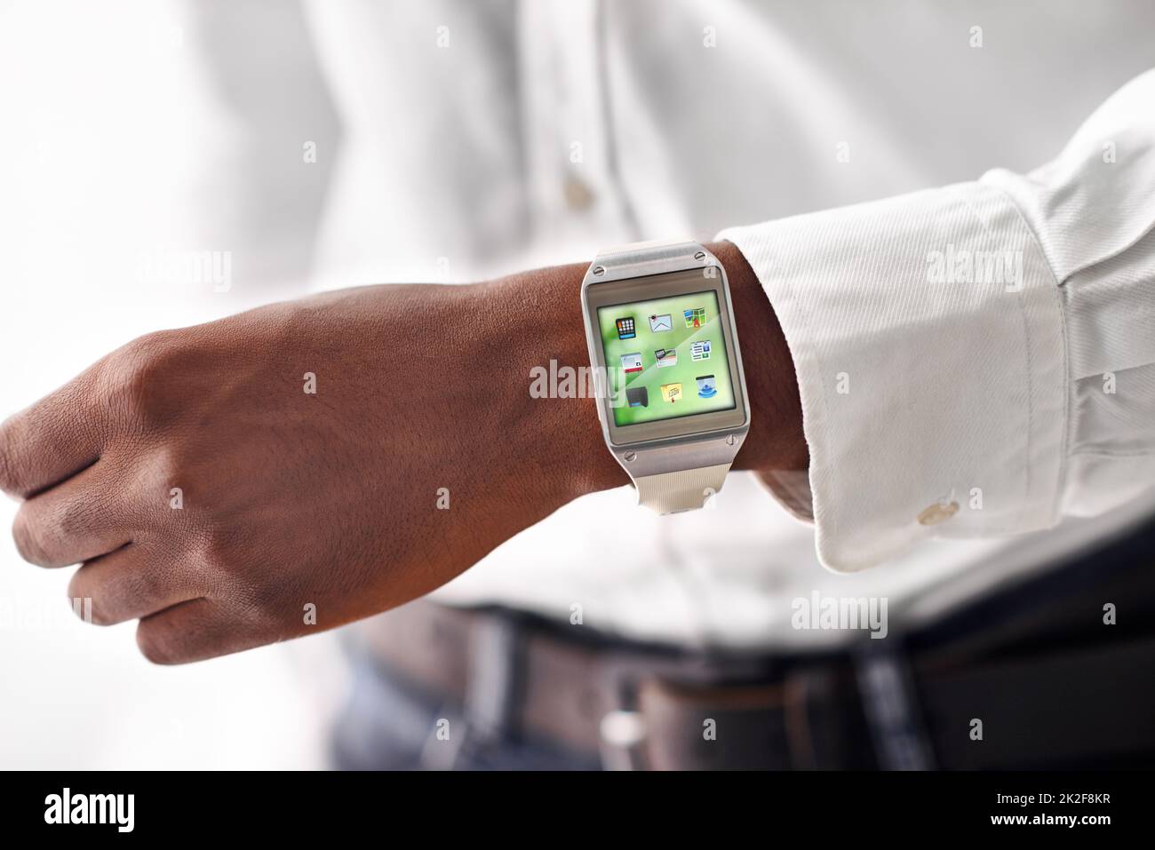 Taking technology on the go. Cropped view of a man wearing a smartwatch - All screen content is designed by us and not copyrighted by others. Stock Photo