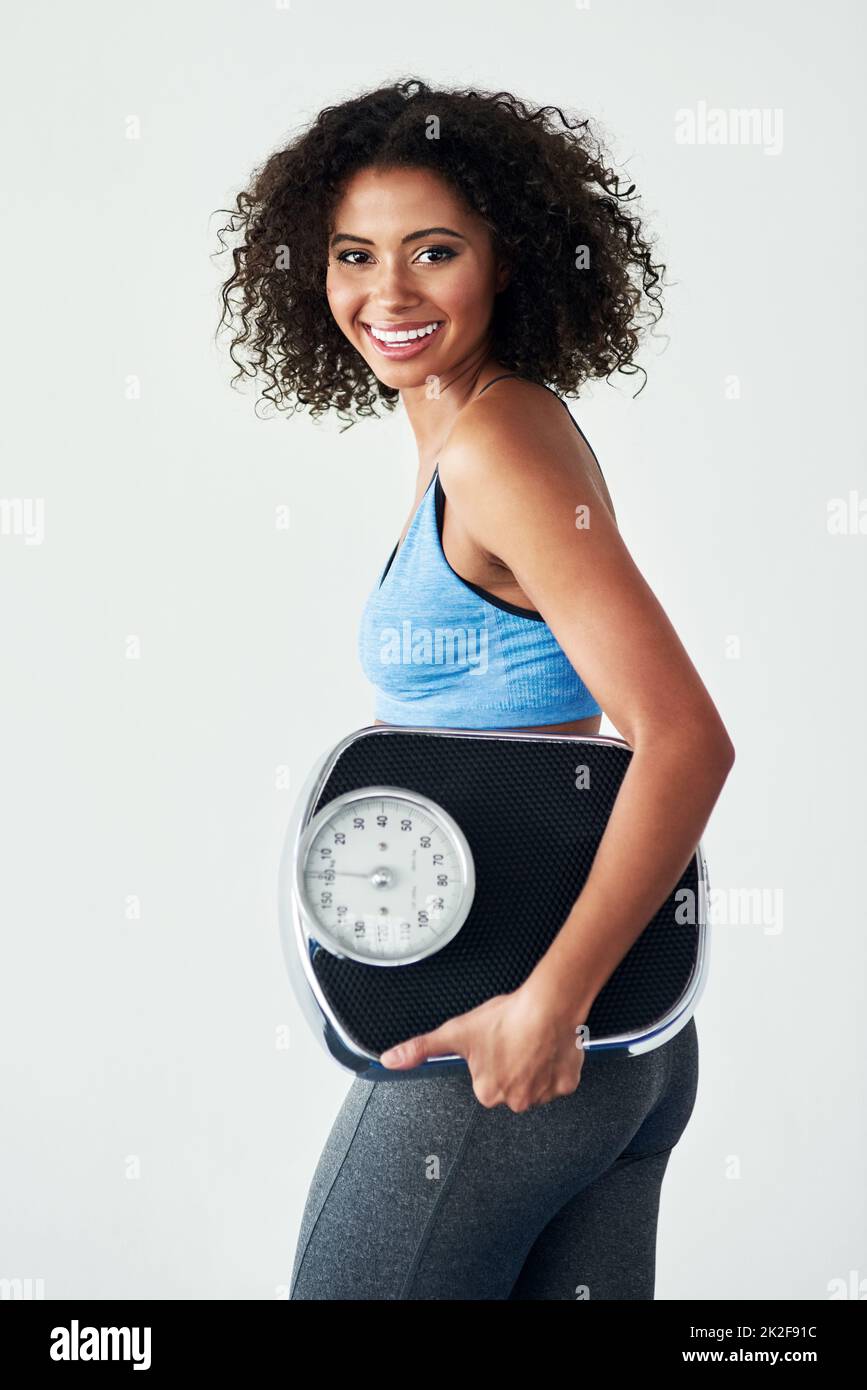 The scale will show you the hard work paying off. Studio shot of an