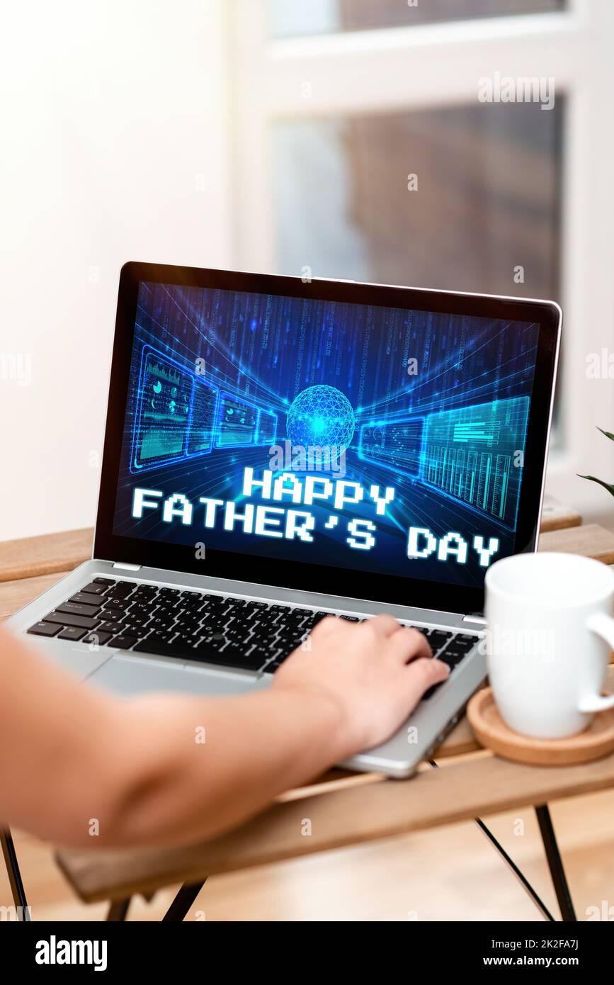 Hand writing sign Happy Fathers Day. Word for celebrated to show love for the patriarch of the family Both Hands Typing On Laptop Next To Cup And Plant Working From Home. Stock Photo