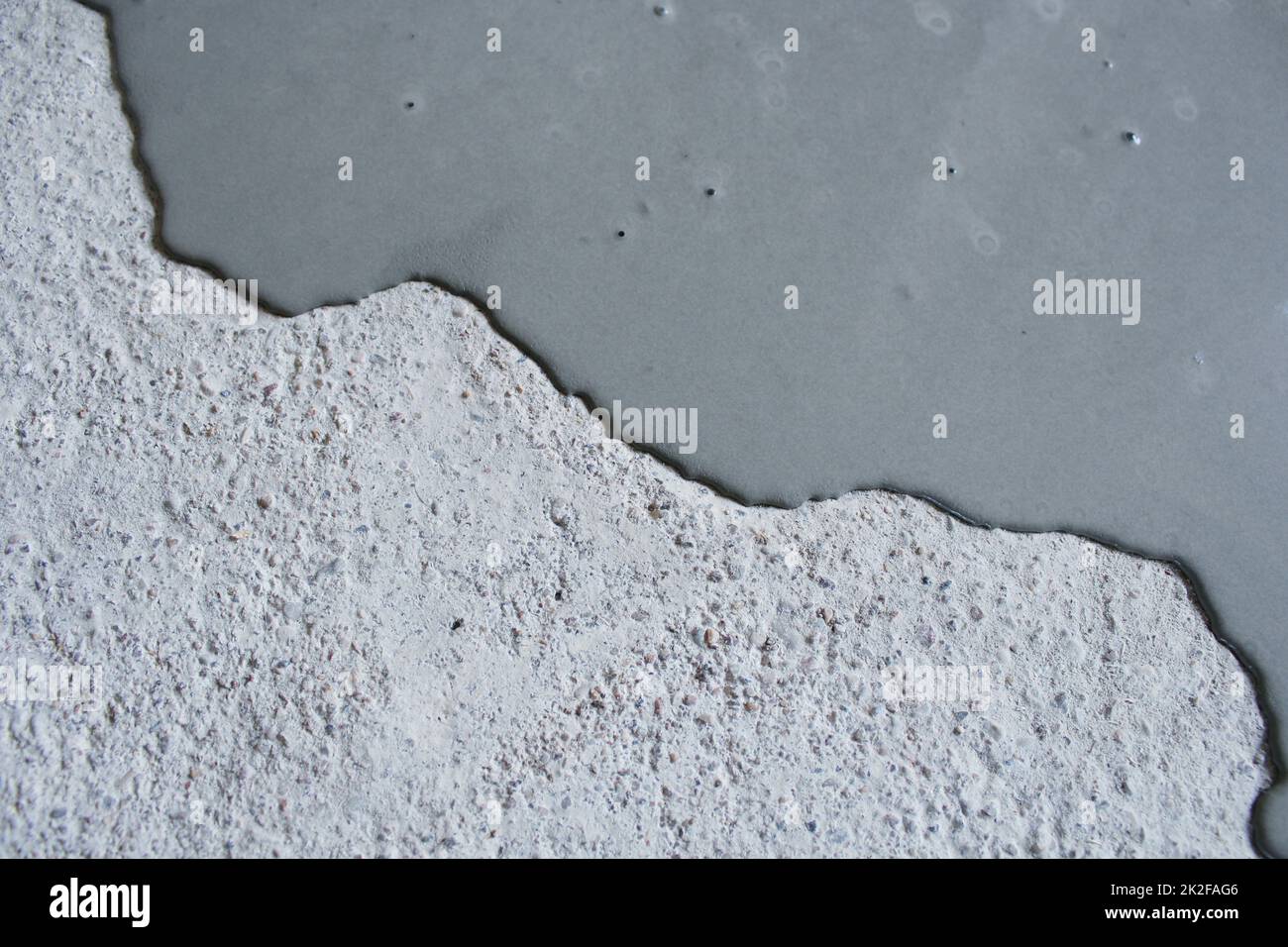 Concrete background. Self leveling compound spreading Stock Photo Alamy