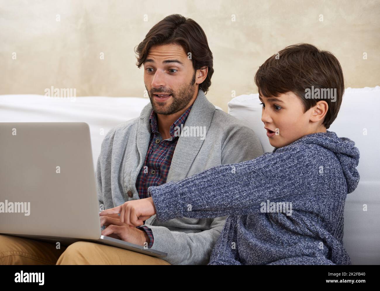 Boy playing game on laptop hi-res stock photography and images - Alamy