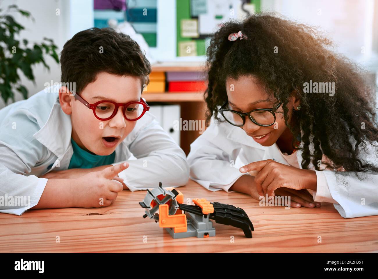 Fun and learning go hand in hand. Shot of an adorable little boy and girl building a robot in science class at school. Stock Photo
