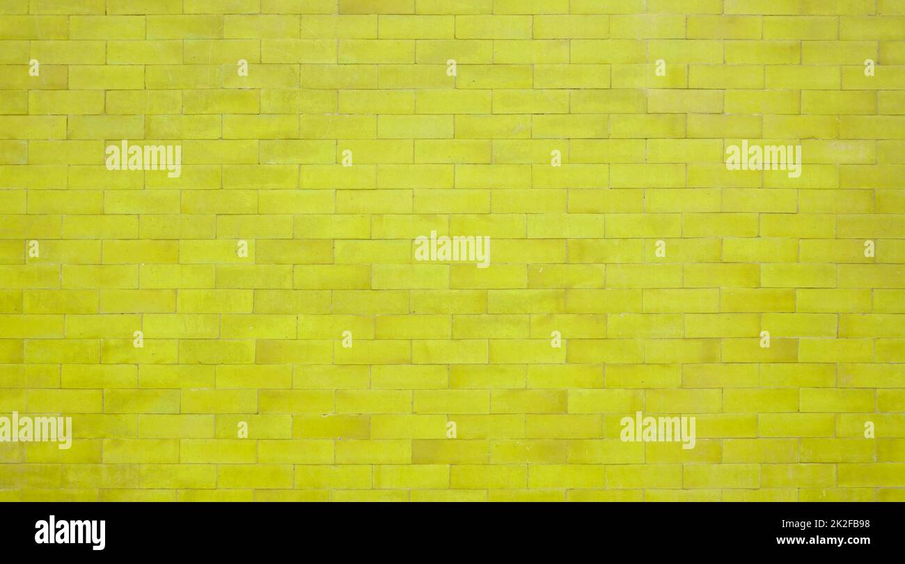 Old yellow brick wall texture background Stock Photo - Alamy