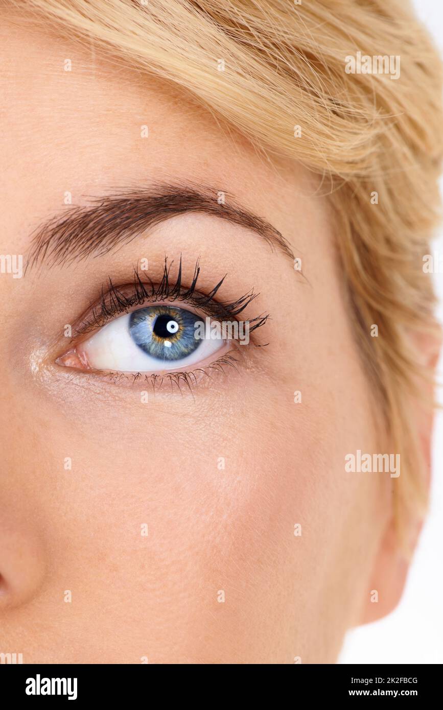 Things are looking up.... A closeup of a young womans eye. Stock Photo