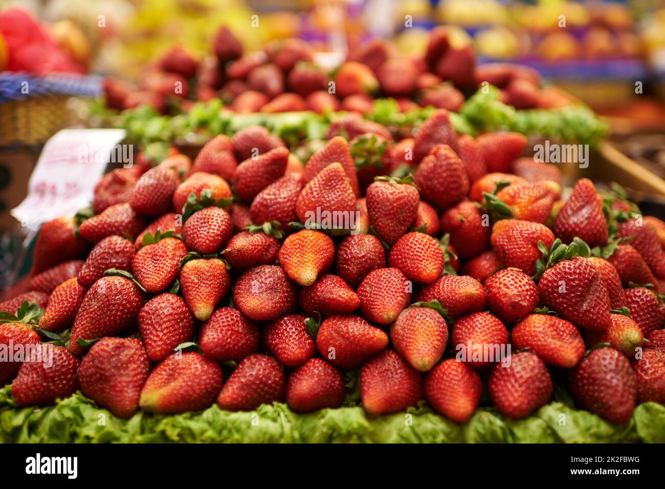 Juicy strawberries. A display of delicious red strawberries at a food market. Stock Photo