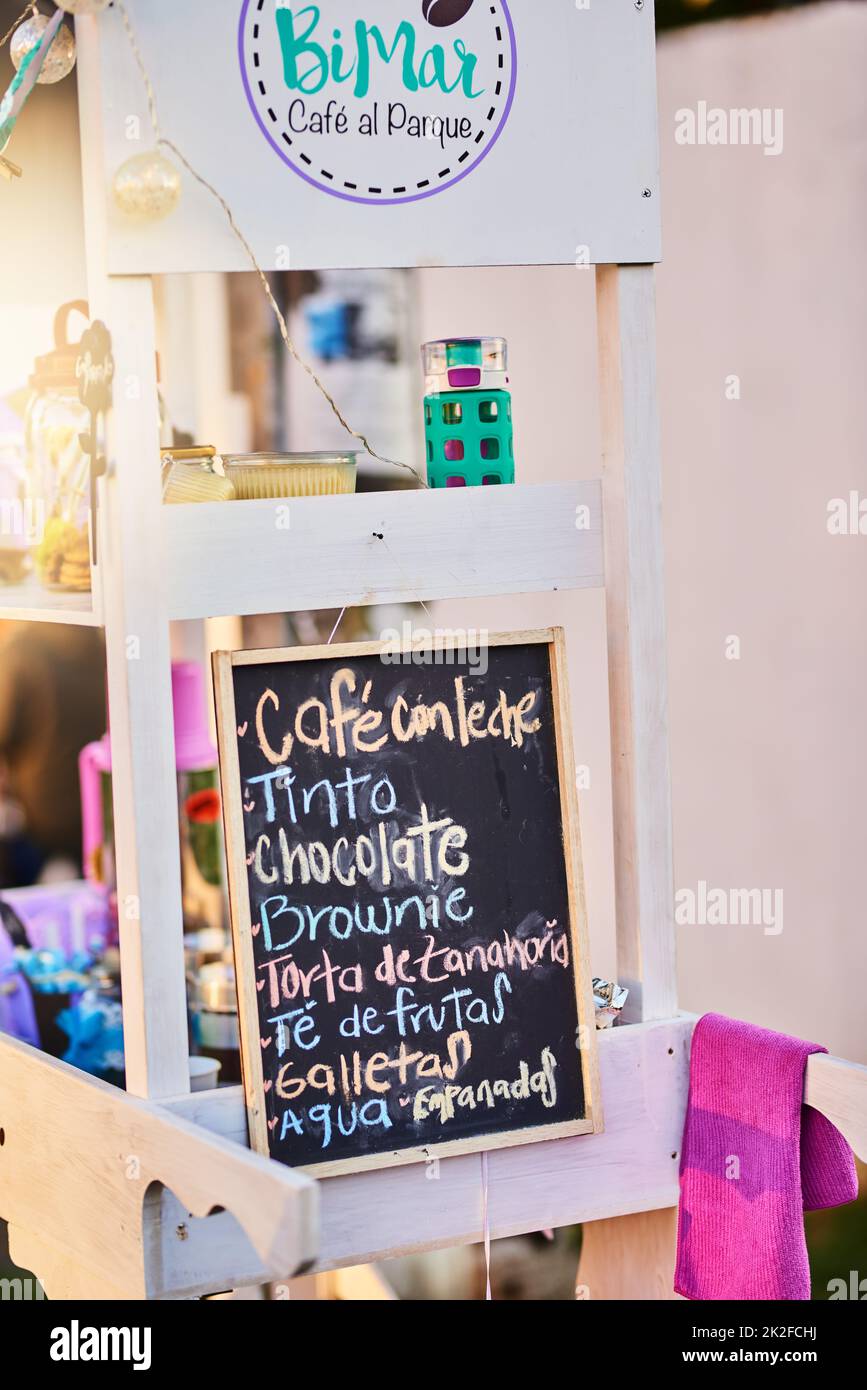 Such a great variety to choose from. Shot of a baked goods stall with a variety of goods to choose from and written down on a chalk board. Stock Photo