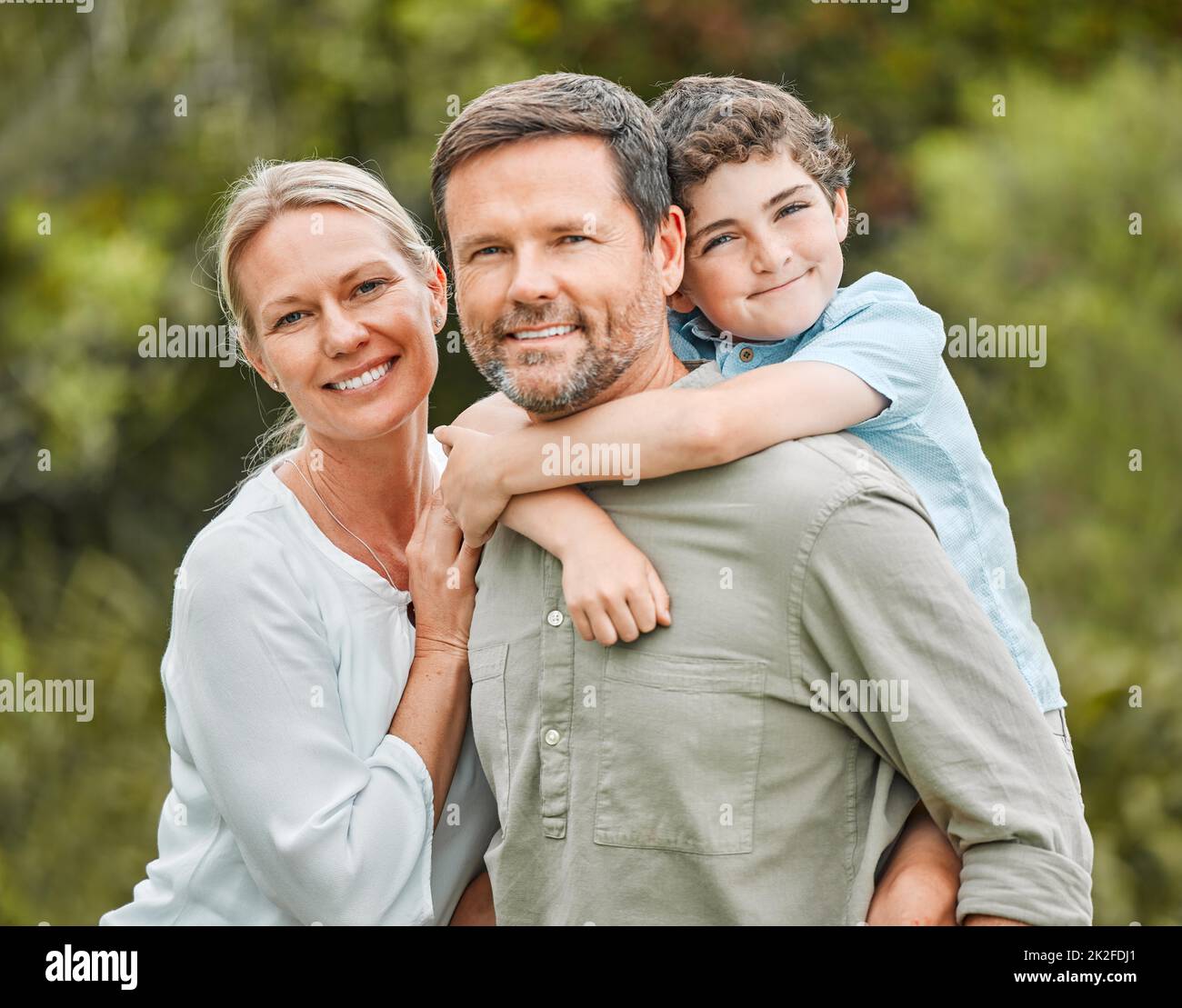 Perfect doesnt exist but family is pretty perfect. Shot of a couple and their young son spending time outdoors. Stock Photo