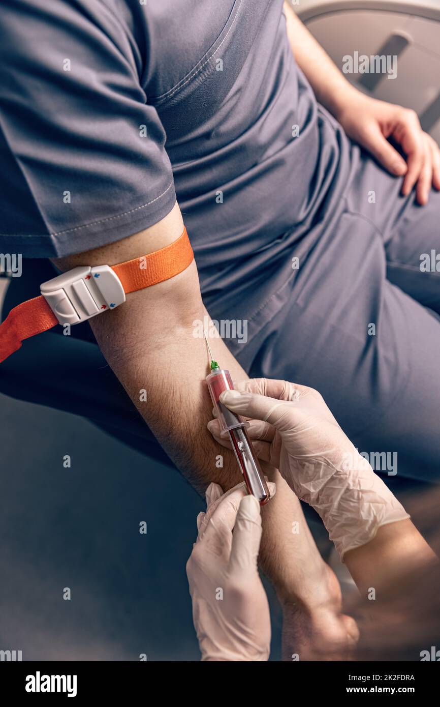 Collecting blood sample for diagnosis Stock Photo