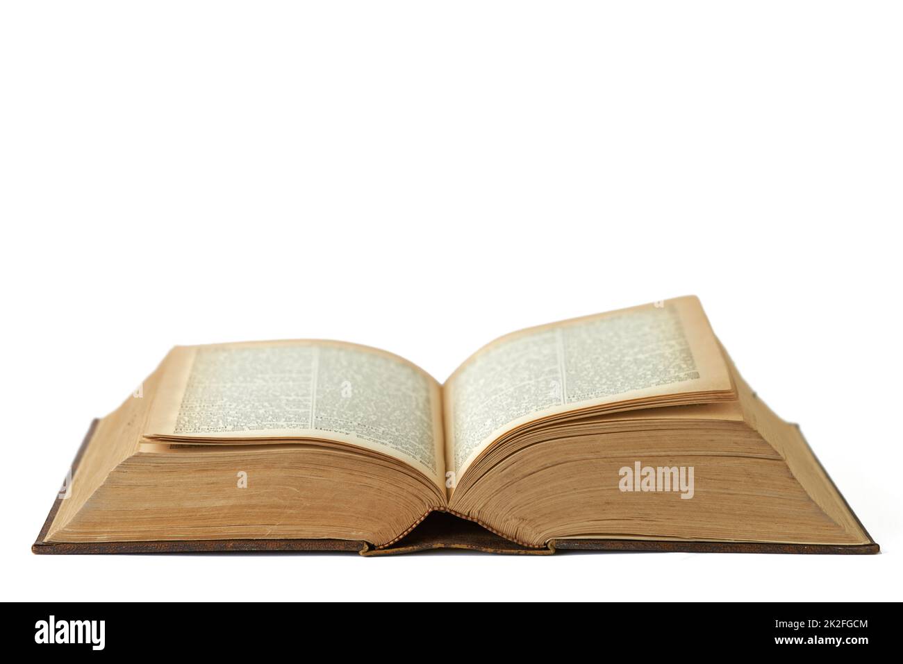 History lies between the pages. An opened antique book against a white background. Stock Photo