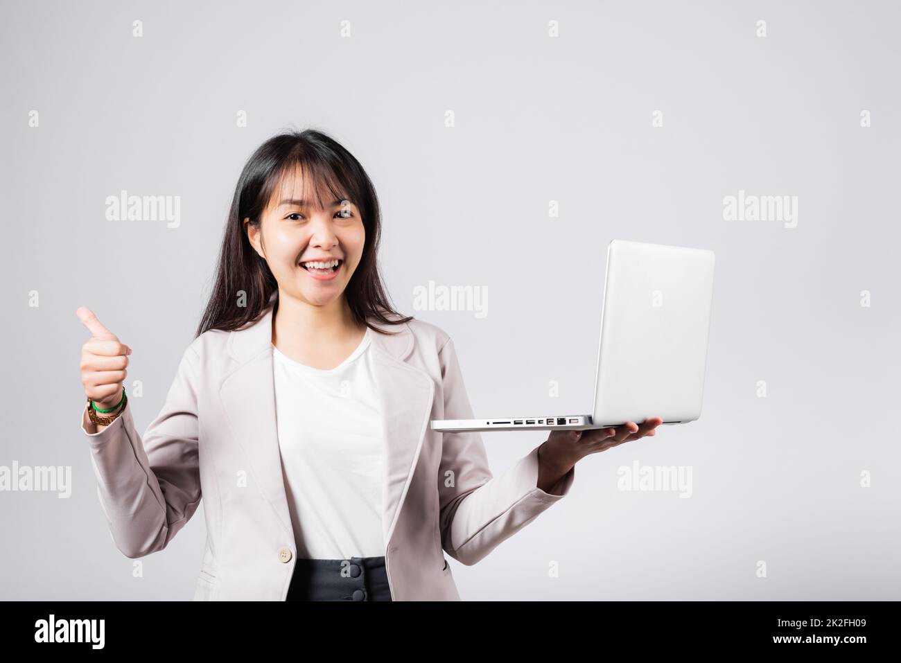 Woman smile confident smiling face hold using laptop computer and ...