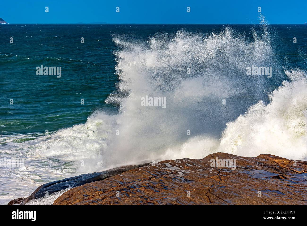 Stormy wave splashing into the air Stock Photo