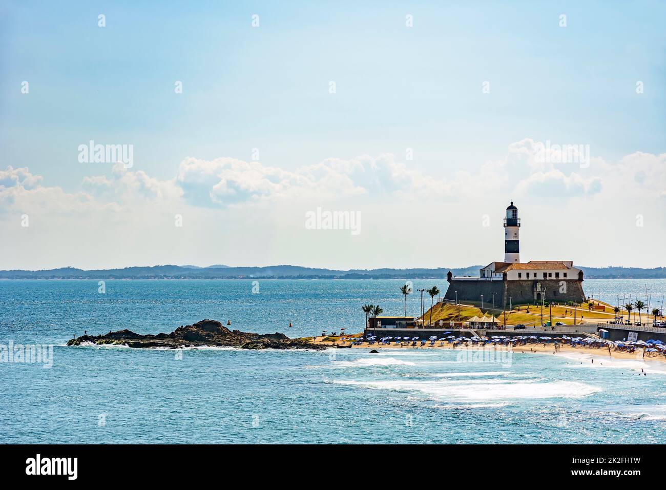 Barra beach and lighthouse with the summer sun of Salvador Stock Photo