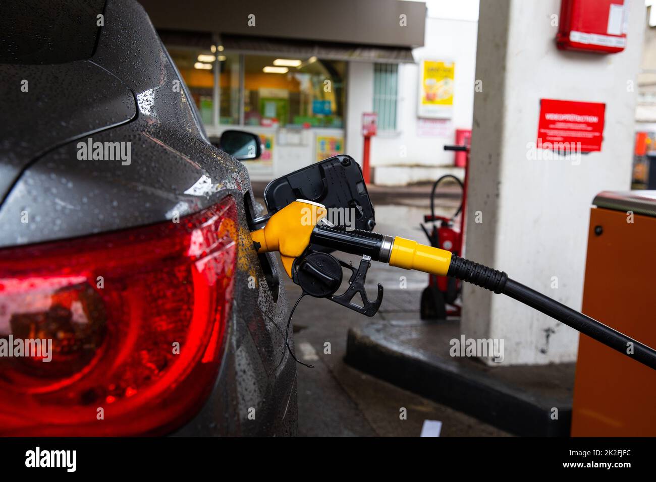 Refueling refilling car vehicle with fuel at refuel fuel gas pump