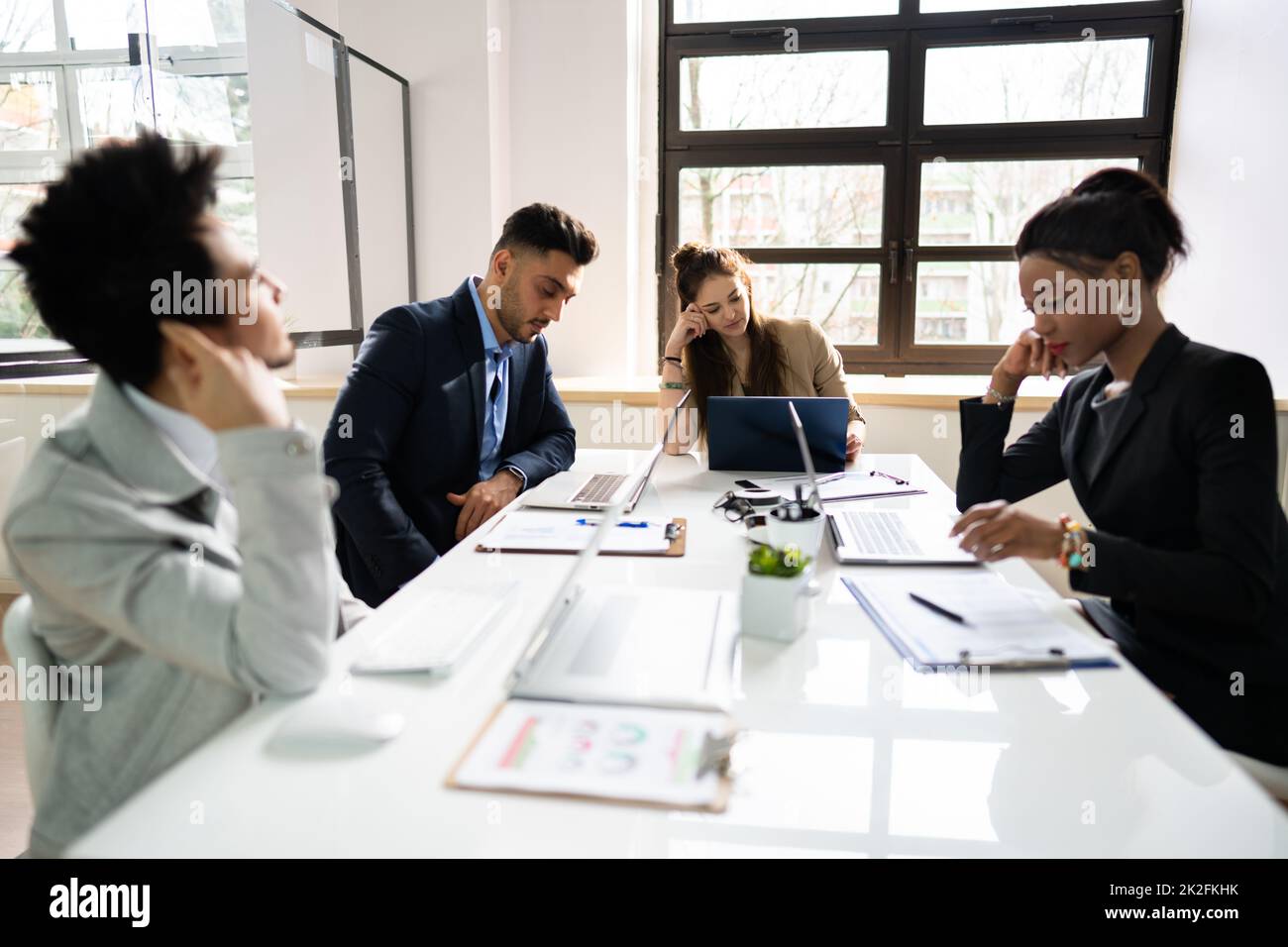 Diverse Bored Meeting Training Presentation Stock Photo