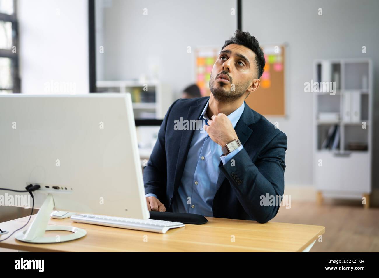Hot Office Weather. Man Sweating Stock Photo