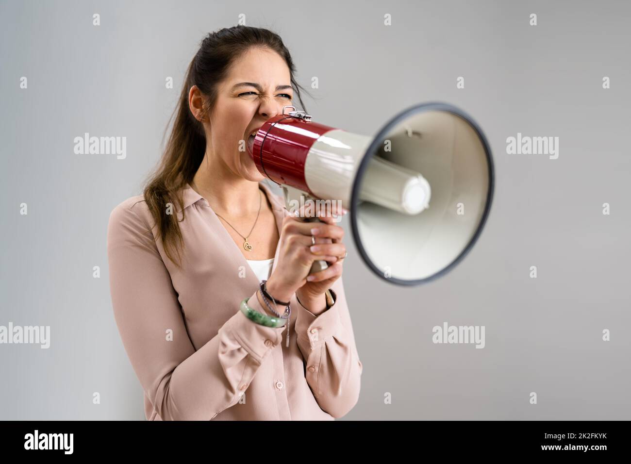 People Shout And Scream Through Megaphone Stock Photo