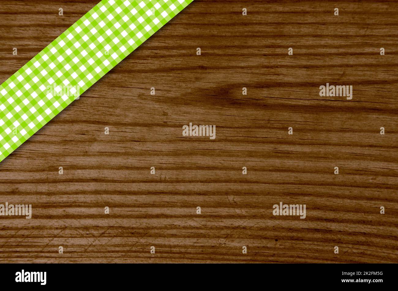 Green tablecloth stripe on old wooden board Stock Photo