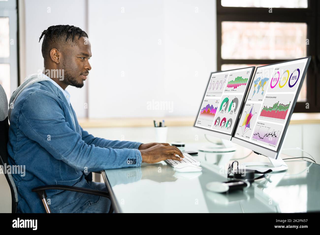 African Advisor Using KPI Dashboard Stock Photo