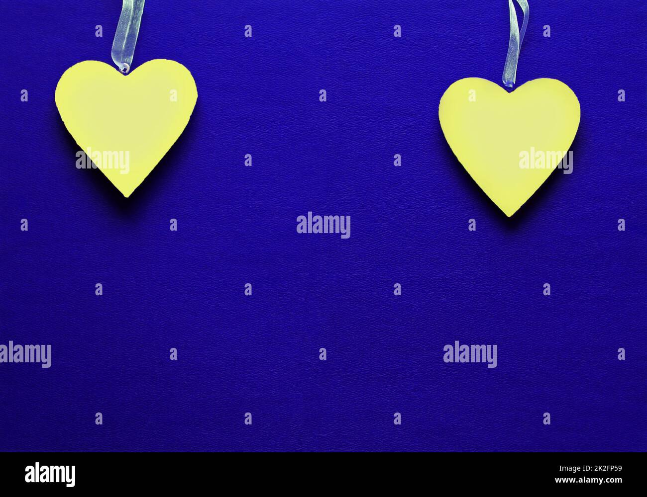 Two yellow hearts on blue background. The colors of Ukraine Stock Photo