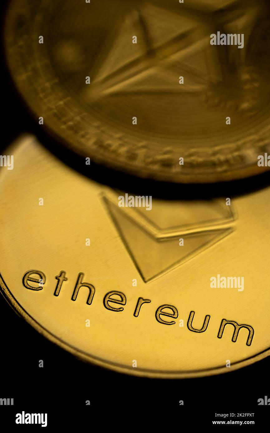 Close up shot of a golden Ethereum digital cryptocurrency, front and back. Stock Photo