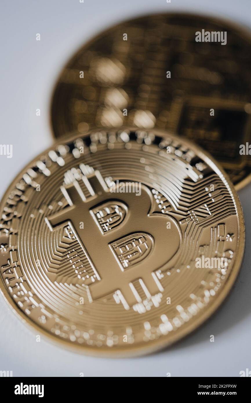 Close up shot of a golden bitcoin digital cryptocurrency. Stock Photo