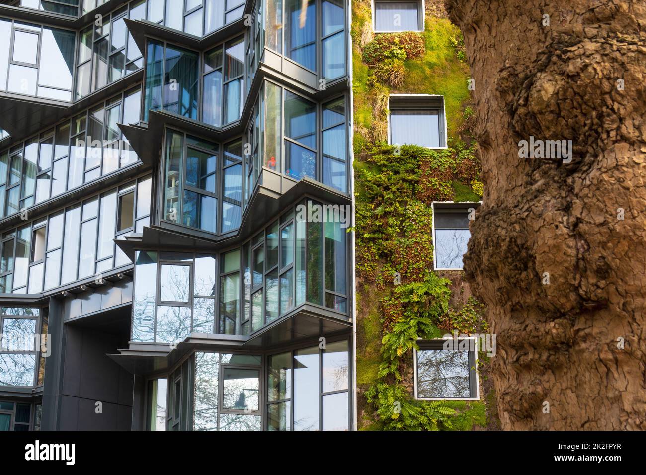 Vegetated green building in the city Stock Photo