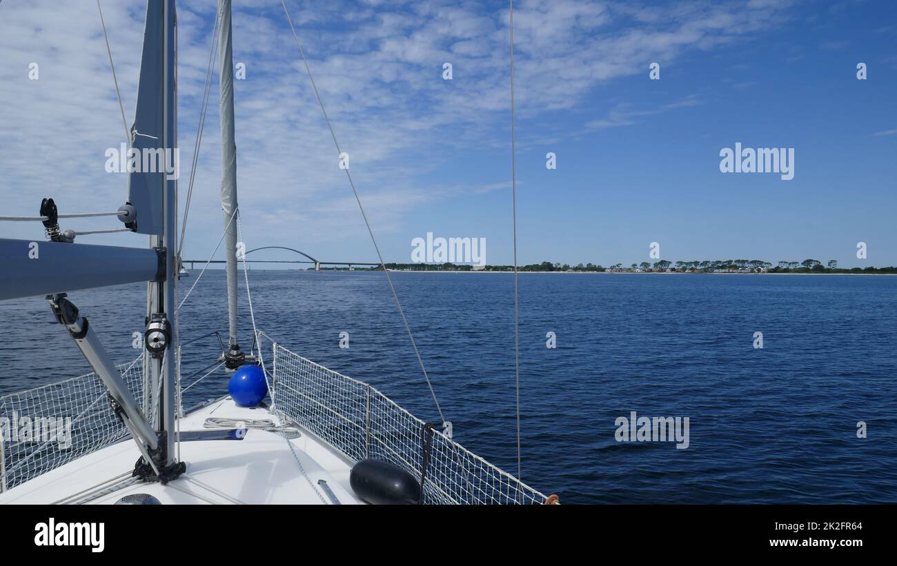 Sailing yacht approaches Fehmarn Bridge Stock Photo