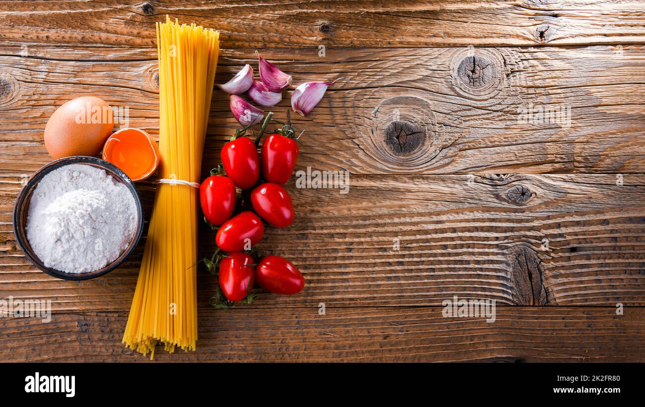 Composition with dried spaghetti, and pasta ingredients Stock Photo